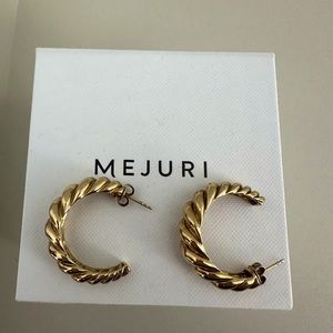 Mejuri large croissant dome hoops.